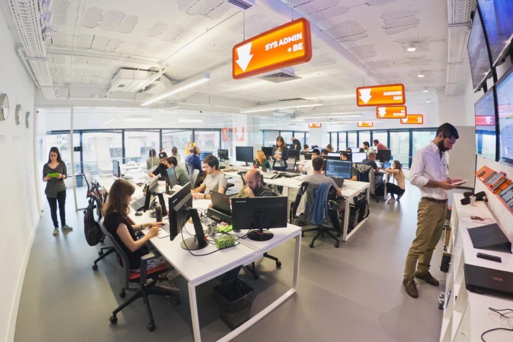 People working in an open space with computers