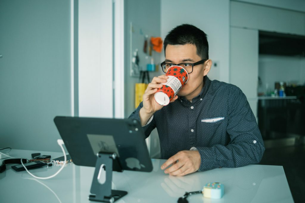 Developer drinking from a christmas cup