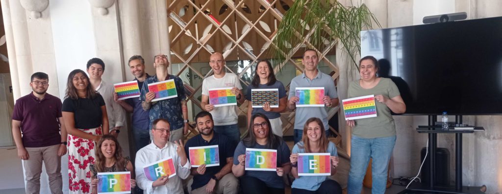 PagerDuty team holding pride signs