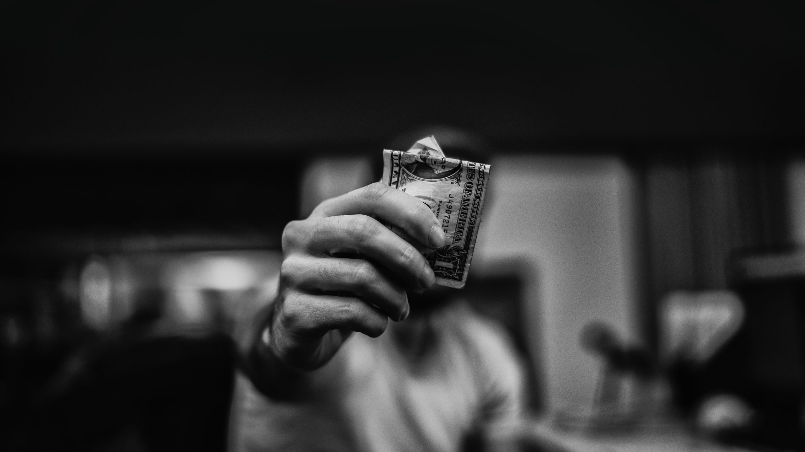 man holding stack of bills