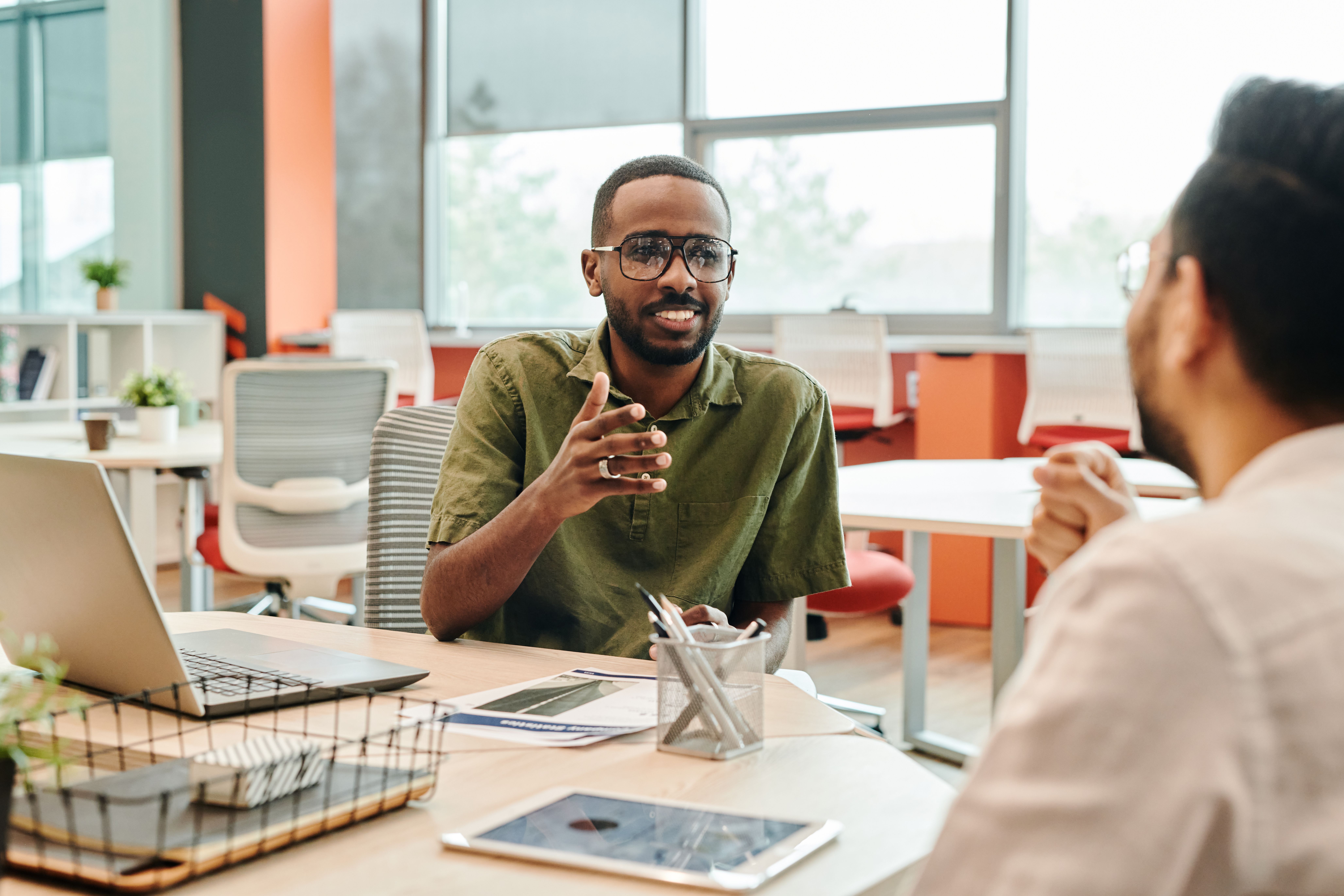two people having a meeting in an office